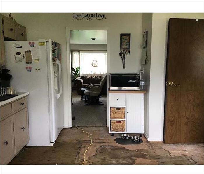 Kitchen with floor tiles missing 