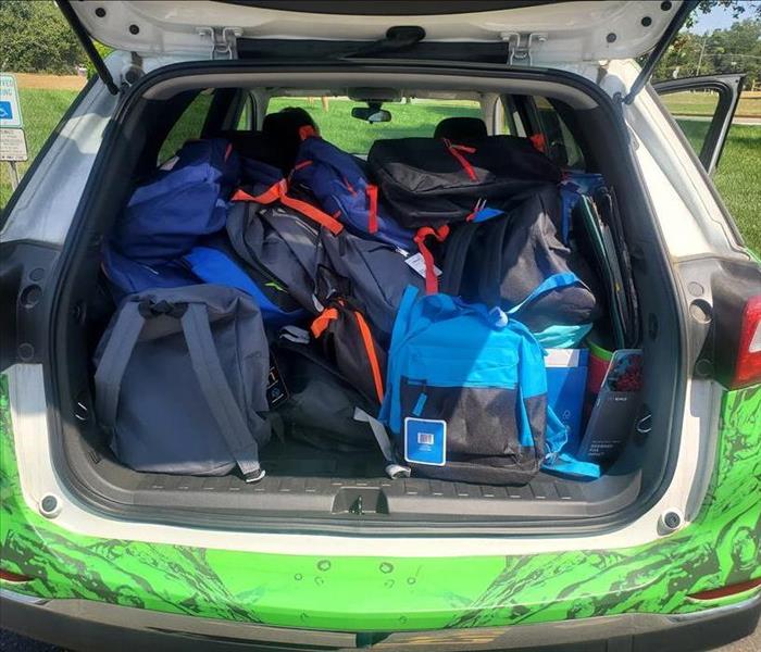 SERVPRO of Toms River car filled with backpack and school supplies for 