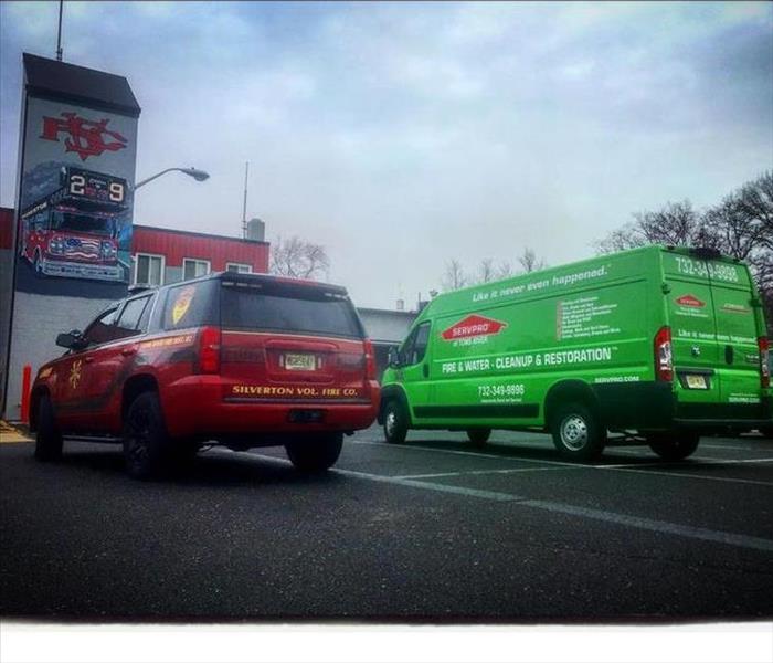 Silverton Volunteer Fire Company and SERVPRO of Toms River trucks outside the Silverton Volunteer Fire Company Building 