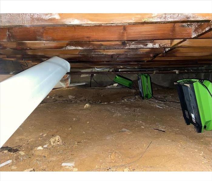 Crawl space with SERVPRO air movers