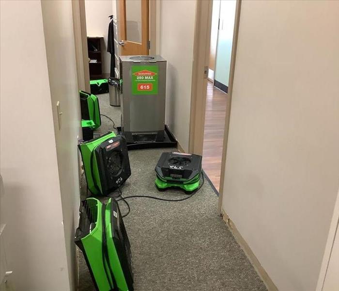 SERVPRO of Toms River drying equipment in the hallway of an office building